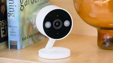 Tapo C120 security camera pictured on a shelf