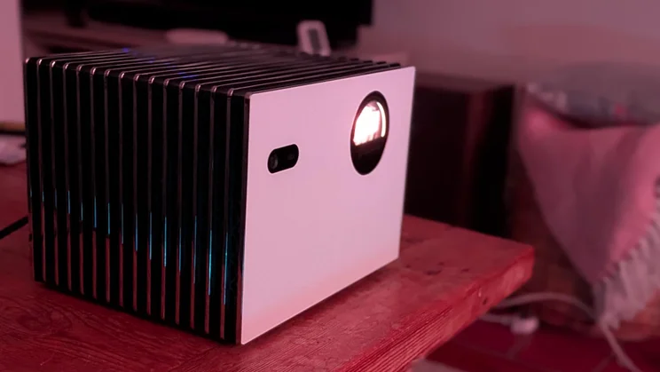 Side view of the Valerion StreamMaster Plus 2 4K projector in a dark room