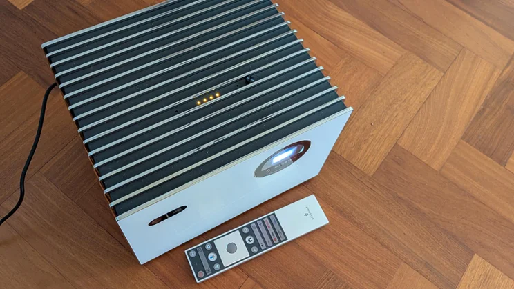 Top-down view of the Valerion StreamMaster Plus 2 4K projector with its remote control