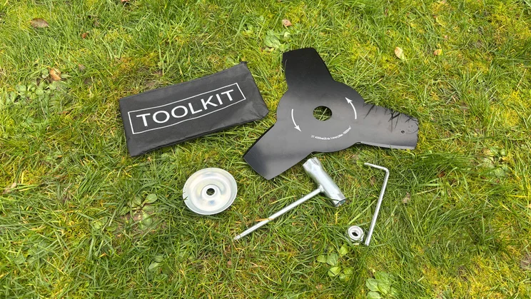 VonHaus 36V cordless 2-in-1 grass trimmer - misc box contents on grass