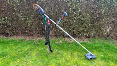 VonHaus 36V cordless 2-in-1 grass trimmer - wide shot of trimmer propped up on grass