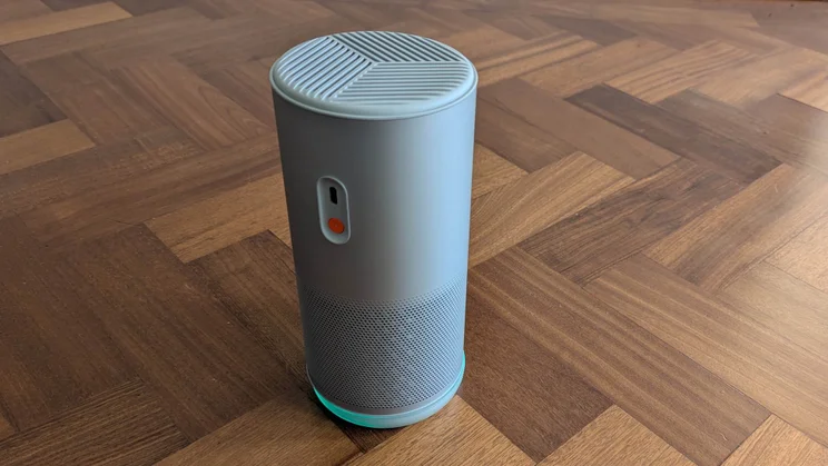 The XGIMI MoGo 4 Laser projector on a wooden floor in Bluetooth speaker mode