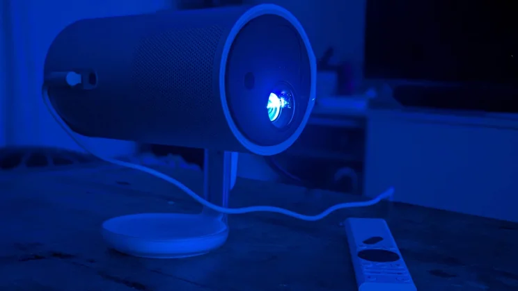 The XGIMI MoGo 4 Laser projector projecting an image in a darkened room