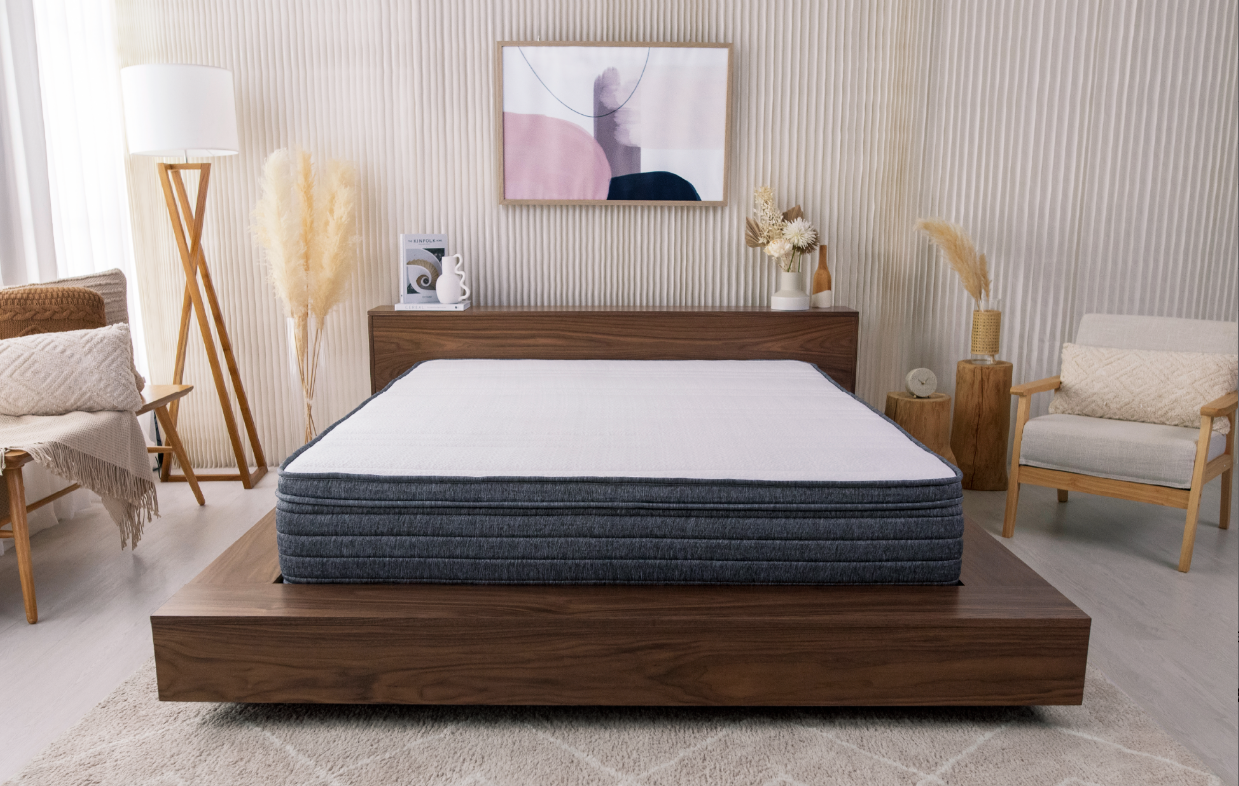 Bed with Origin Hybrid Mattress in decorated room