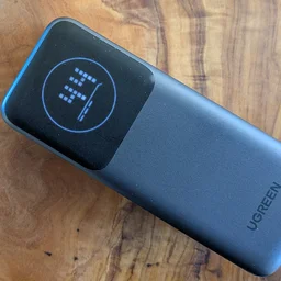 The UGreen Nexode PB724 pictured on its back with the screen on