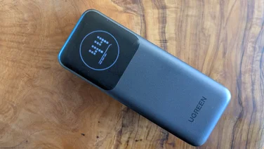 The UGreen Nexode PB724 pictured on its back with the screen on